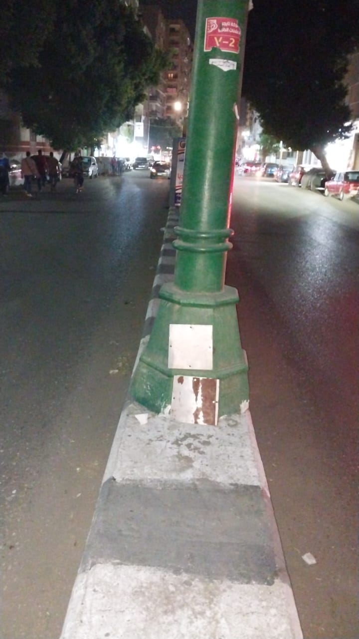 حملة لتغطية أعمدة الإنارة بشارع الجمهورية ونفق الازهر في مدينة أسيوط