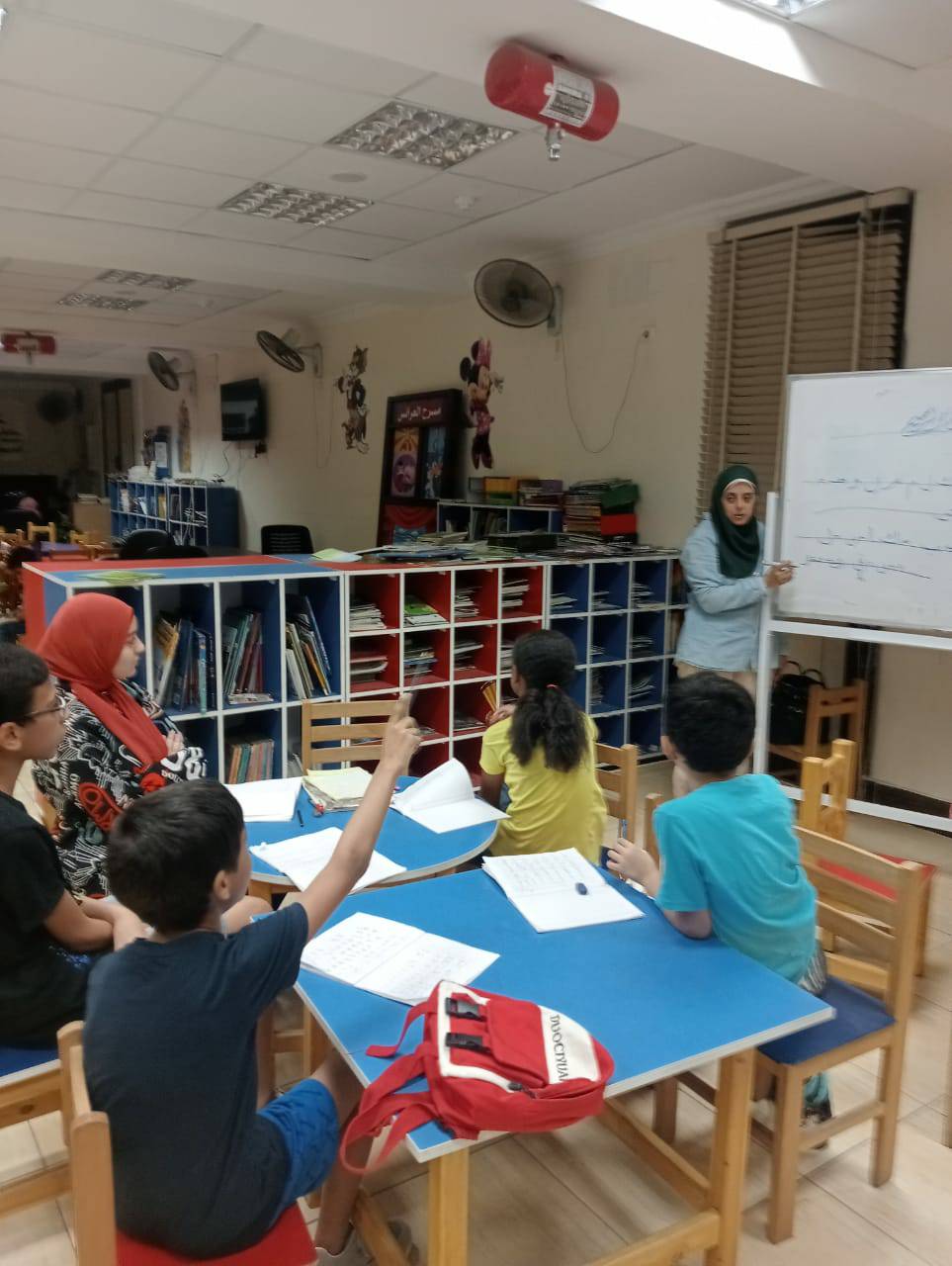 تعليم الخط العربي للاطفال في مكتبة مصر العامة اسيوط