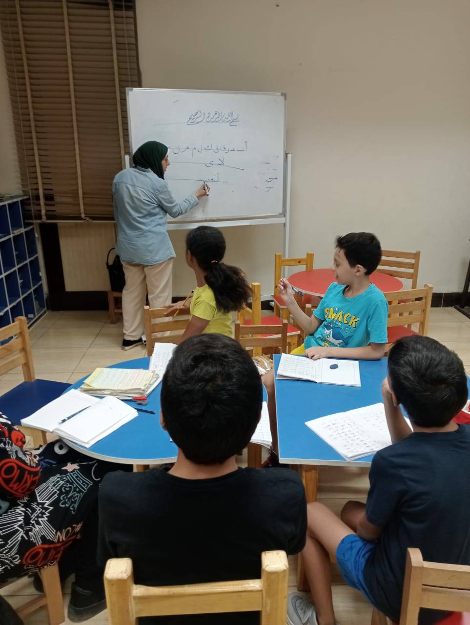 تعليم الخط العربي للاطفال في مكتبة مصر العامة اسيوط