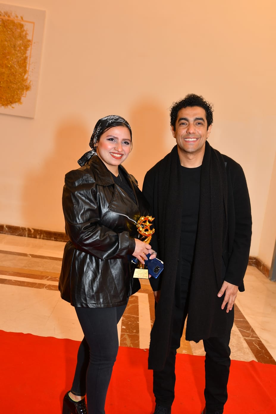 الفنان ميدو عادل مع محررة الوفد