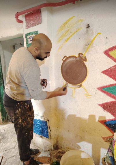 أهالي عزبة حمادة وتحضيرات إفطار 15 رمضان