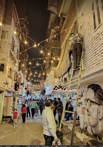 أهالي عزبة حمادة وتحضيرات إفطار 15 رمضان