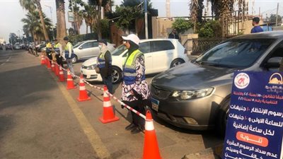 قانون السايس يسيطر على شوارع الدقى والدفع إلكترونى