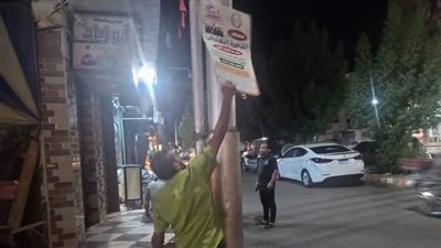 قنا تنفذ حملة لرفع اللافتات من الشوارع 