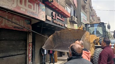 حملات لرفع تعديات المحال والباعة من الطريق العام بشوارع الوراق 