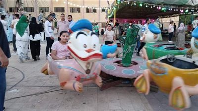  أهالي كفر الدوار يحتفلون بعيد الأضحى وسط الملاهي 