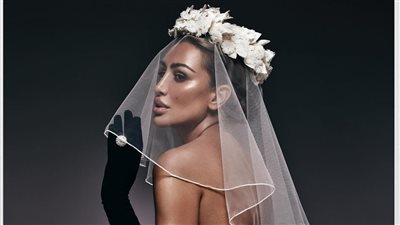 مايا دياب تشعل الأجواء بفستان زفاف مثير