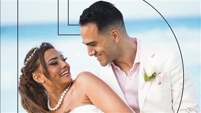 بشرى تطل بالأبيض بين أحضان خالد محمود حميدة.. أول صور من حفل الزفاف عالبحر 