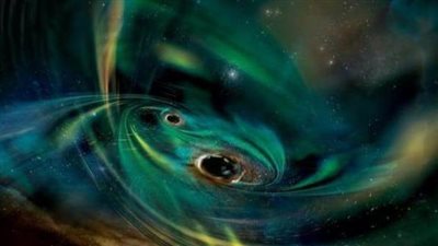 اكتشاف مثير.. ثنائي من الثقوب السوداء العملاقة يلتهم سحابة غاز في مجرة بعيدة