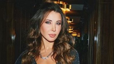 نانسي عجرم تُزين حفل أبو ظبي وترفع علم لبنان 
