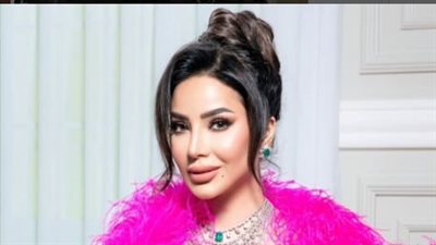 لجين عمران تبرز ملامحها بالأحمر الصارخ 