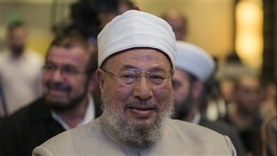 سر عدم رفع اسم يوسف القرضاوي من قوائم الإرهاب رغم وفاته (فيديو)