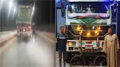 النيابة تحقق مع شاب تشبث بسيارة نقل فوق كوبري بأسيوط