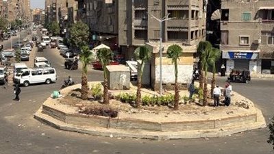 أعمال تطوير وتجميل ميدان الشجرة بشارع المطار في المنيرة الغربية